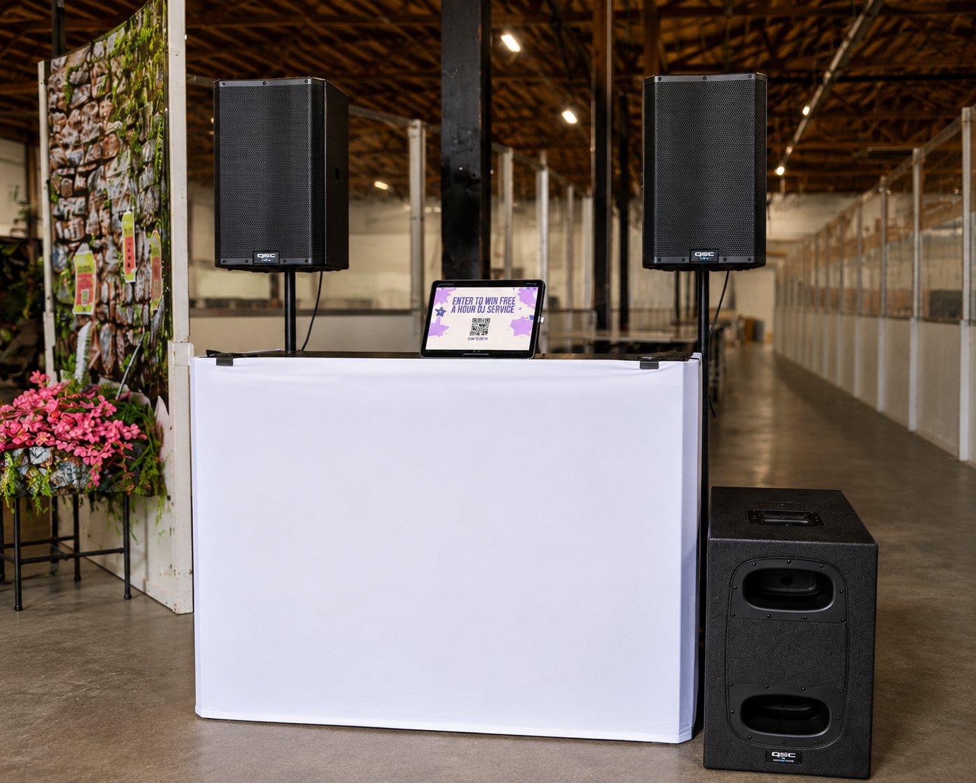 Clean white DJ booth and sound system